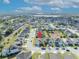 Aerial view of a charming home nestled within a vibrant suburban neighborhood with scenic lake views at 822 Sheen Cir, Haines City, FL 33844