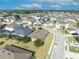 Expansive aerial view of a residential neighborhood featuring well-maintained homes and landscaped yards on a sunny day at 822 Sheen Cir, Haines City, FL 33844