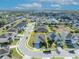 Aerial view of home showcasing the roof, driveway, and landscaping within property lines in a suburban neighborhood at 822 Sheen Cir, Haines City, FL 33844