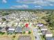 Aerial view of a charming home nestled within a vibrant suburban neighborhood with scenic green views at 822 Sheen Cir, Haines City, FL 33844