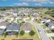 Aerial view of a charming home nestled within a vibrant suburban neighborhood with scenic green views at 822 Sheen Cir, Haines City, FL 33844