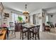 Comfortable dining space with seating for four, a built-in bar, and ample natural light at 822 Sheen Cir, Haines City, FL 33844