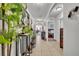 Bright hallway with tiled floors, arched doorways, and decorative elements leading to other rooms at 822 Sheen Cir, Haines City, FL 33844