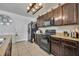 Functional kitchen design with dark wood cabinetry, and modern appliances at 822 Sheen Cir, Haines City, FL 33844