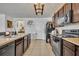 Featuring dark cabinets, modern appliances, and ample counter space at 822 Sheen Cir, Haines City, FL 33844