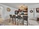 Kitchen showcasing granite countertops, breakfast bar with seating, and modern appliances at 822 Sheen Cir, Haines City, FL 33844