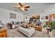 Bright living area showcasing comfortable seating and a view into the kitchen and dining space at 822 Sheen Cir, Haines City, FL 33844