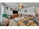 Comfortable living room featuring a ceiling fan, ample seating, and stylish decor at 822 Sheen Cir, Haines City, FL 33844
