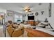 Cozy living room featuring plush seating, a ceiling fan, and an entertainment center with a TV at 822 Sheen Cir, Haines City, FL 33844