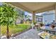 Covered patio overlooking the backyard and landscaping, perfect for outdoor relaxation and entertaining at 822 Sheen Cir, Haines City, FL 33844