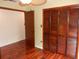 Bedroom showcasing wood floors and a spacious closet at 872 Huckleberry Ln, Winter Springs, FL 32708