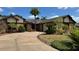 Charming single-Gathering home with a circular driveway and mature landscaping at 872 Huckleberry Ln, Winter Springs, FL 32708