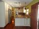 Updated kitchen with stainless appliances, custom cabinets, and hardwood floors at 872 Huckleberry Ln, Winter Springs, FL 32708