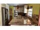 Kitchen with stainless steel appliances, granite counters, and hardwood floors at 872 Huckleberry Ln, Winter Springs, FL 32708