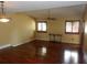 Bright living room with wood floors and natural light from large windows at 872 Huckleberry Ln, Winter Springs, FL 32708