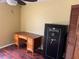 Bright office space features a wood desk and a large safe at 872 Huckleberry Ln, Winter Springs, FL 32708