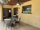 Covered patio with tile flooring, ceiling fan, and outdoor dining set at 872 Huckleberry Ln, Winter Springs, FL 32708