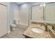 Well-lit bathroom features a shower, separate tub, and granite countertops at 9055 Treasure Trove Ln # 501, Kissimmee, FL 34747