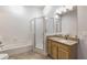 Well-maintained bathroom features a shower, separate tub, and granite countertops at 9055 Treasure Trove Ln # 501, Kissimmee, FL 34747