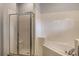 Clean bathroom showcasing a walk-in shower, soaking tub, and tile surround at 9055 Treasure Trove Ln # 501, Kissimmee, FL 34747