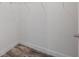 Walk-in closet with wood-style flooring, wire rack shelving, and ample storage space at 9055 Treasure Trove Ln # 501, Kissimmee, FL 34747