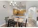 Cozy dining area adjacent to the kitchen, featuring modern lighting and wood-look flooring at 9055 Treasure Trove Ln # 501, Kissimmee, FL 34747