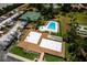 Overhead view of community amenities including a pool, basketball and tennis courts, boat storage, and clubhouse at 10108 Matchlock Dr, Orlando, FL 32821