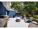 Spacious backyard featuring a patio area, lush trees, and well-manicured landscaping at 10108 Matchlock Dr, Orlando, FL 32821
