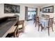 Dining room with a table for six, sliding glass doors, and modern decor at 10108 Matchlock Dr, Orlando, FL 32821