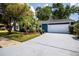 Charming single-story home with a well-maintained front yard and a two-car garage at 10108 Matchlock Dr, Orlando, FL 32821