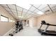 Community gym with an elliptical, treadmill, and other equipment with tile flooring at 10108 Matchlock Dr, Orlando, FL 32821