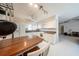 Bright kitchen with white cabinetry, track lighting, and a center island with seating at 10108 Matchlock Dr, Orlando, FL 32821
