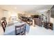 Open-concept living room and dining area featuring a bar, modern furnishings, and ample space at 10108 Matchlock Dr, Orlando, FL 32821