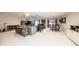 Open-concept living room and dining area featuring a bar, modern furnishings, and ample space at 10108 Matchlock Dr, Orlando, FL 32821