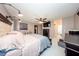 Comfortable main bedroom with large bed, ceiling fan, dresser, bedside tables, and ensuite at 10108 Matchlock Dr, Orlando, FL 32821
