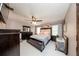 Comfortable main bedroom with large bed, ceiling fan, dresser, and bedside tables at 10108 Matchlock Dr, Orlando, FL 32821