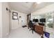 Bright home office featuring tile floors, a large window, and custom bookshelves at 10108 Matchlock Dr, Orlando, FL 32821