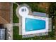 Aerial view of the rectangular community pool with lounge chairs and shaded seating areas at 10108 Matchlock Dr, Orlando, FL 32821