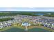 Aerial view of the neighborhood featuring a community pool, playground, lake, and meticulously planned streets at 1105 Grand Hammock Ct, Kissimmee, FL 34746