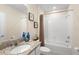 Clean bathroom with granite vanity, tiled backsplash, and a well-maintained tub and shower at 1105 Grand Hammock Ct, Kissimmee, FL 34746