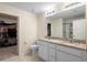 Well-appointed bathroom with dual sinks, granite countertops, and ample storage space at 1105 Grand Hammock Ct, Kissimmee, FL 34746
