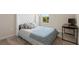 Comfortable bedroom featuring a stylish upholstered headboard and a serene, inviting ambiance at 1105 Grand Hammock Ct, Kissimmee, FL 34746