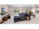 Spacious living room featuring modern decor, a plush sectional, and an open floor plan at 1105 Grand Hammock Ct, Kissimmee, FL 34746