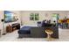 This living room showcases stylish sectional seating, a modern TV setup, and an open layout at 1105 Grand Hammock Ct, Kissimmee, FL 34746
