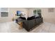 Spacious living room with a large sectional couch and modern decor, perfect for entertaining at 1105 Grand Hammock Ct, Kissimmee, FL 34746