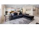 Living room features a comfortable sectional sofa and tile floors, perfect for relaxing and entertaining at 1105 Grand Hammock Ct, Kissimmee, FL 34746