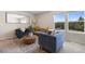 Bright and airy living room with modern furniture and a large window offering serene views at 1105 Grand Hammock Ct, Kissimmee, FL 34746