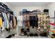 Spacious walk-in closet features ample shelving and hanging space for optimal organization at 1105 Grand Hammock Ct, Kissimmee, FL 34746
