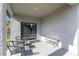 Covered patio with sliding glass door, ample space, and outdoor seating arrangement at 112 Red Maple Burl Cir, Debary, FL 32713