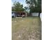 A fenced backyard with a patio area and pergola offers a great space for outdoor living at 1238 Lakecrest Dr, Apopka, FL 32703